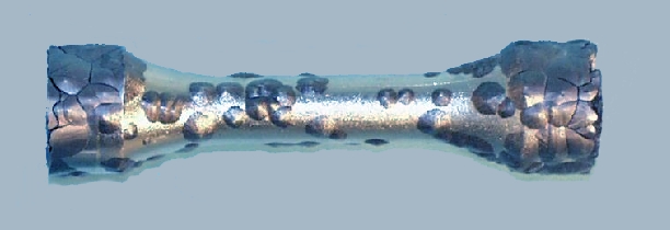 A cast test piece of tin that had developed cracks and warts of tin pest