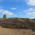 view of the Summit Windmill (on the horizon) over waste heaps