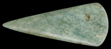 Jadeite Axe - NMS A pale green axe head, pointing left, on a black background.